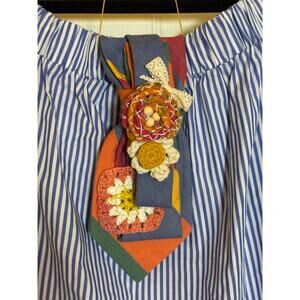 Vintage upcycled necktie with Kantha, pearls, crochet & ribbon embellishments.